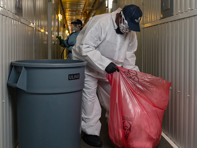 Lady filling trash bags